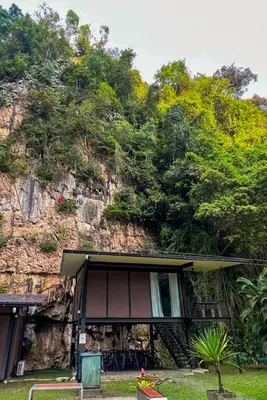 a house in front of a mountain with trees at Xscape Tambun in Ipoh