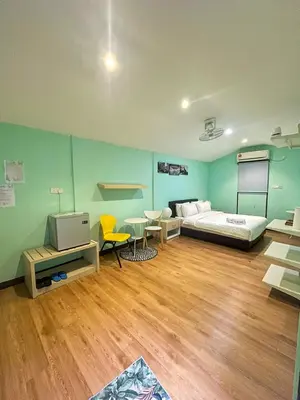 a room with a bed and a tv in it at Xscape Tambun in Ipoh