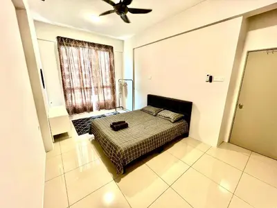 a bedroom with a bed and a ceiling fan at 2BR The Yeop Ipoh Homestay Apartment Casa Kayangan Bandar Meru Raya in Ipoh