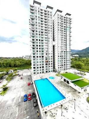 an aerial view of a large building with a swimming pool at 2BR The Yeop Ipoh Homestay Apartment Casa Kayangan Bandar Meru Raya in Ipoh