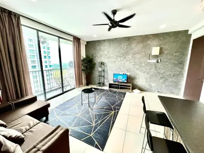 a living room with a couch and a ceiling fan at 2BR The Yeop Ipoh Homestay Apartment Casa Kayangan Bandar Meru Raya in Ipoh