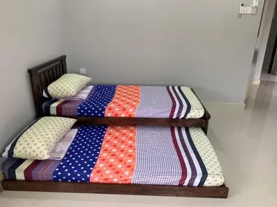two twin beds with pillows on them in a room at Traditional Villa with Modern Design 3R2B in Ipoh