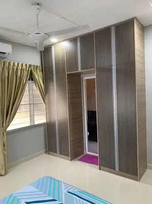 a room with wooden cabinets and a window at Traditional Villa with Modern Design 3R2B in Ipoh