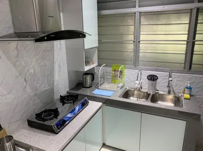 a small kitchen with a sink and a stove at Traditional Villa with Modern Design 3R2B in Ipoh