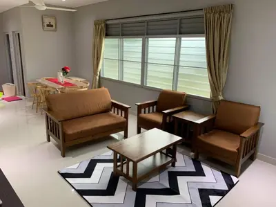 a living room with chairs and a table and a window at Traditional Villa with Modern Design 3R2B in Ipoh