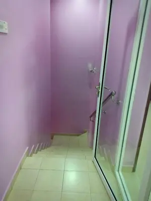 a bathroom with a shower with purple walls at Purple TownHouse 9pax 3R2B Wifi in Sekincan