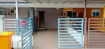 a room with two sets of stairs in a house at Purple TownHouse 9pax 3R2B Wifi in Sekincan