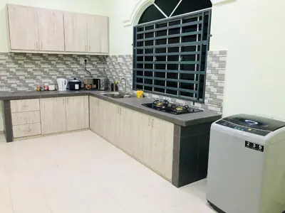 a kitchen with a sink and a counter top at Atocha Homestay - Terong@Taiping in Kampong Salak
