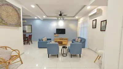 a living room with blue chairs and a tv at Ocean 25 Shamrock Beach Big Group 6 Bedroom 5 Bathroom with Pool in Tanjung Bungah