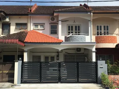 a house with a black gate in front of it at Ipoh Station 18 in Ipoh