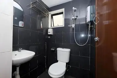 a bathroom with a toilet and a sink and a shower at Heaven Mountain Hill Hotel 1 Cameron Highlands in Cameron Highlands