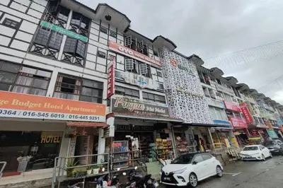 a building with cars parked in front of it at Heaven Mountain Hill 2 Cameron Highlands in Cameron Highlands