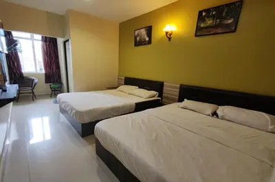 a hotel room with two beds in a room at Heaven Mountain Hill 2 Cameron Highlands in Cameron Highlands