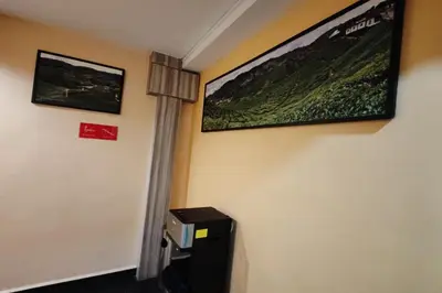 a room with a wall with two pictures on the wall at Heaven Mountain Hill 2 Cameron Highlands in Cameron Highlands