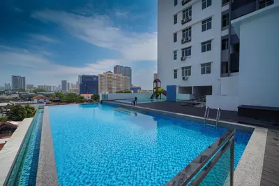 a large swimming pool on the roof of a building at Avatel Jelutong PWCC in George Town