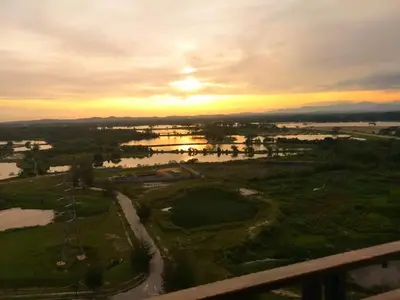 an aerial view of a river at sunset at Kampar Champs Elysees, King Bed Studio unit 12A21 in Kampar