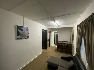 a living room with a couch and a table at Darulmakmur Chalet in Cameron Highlands
