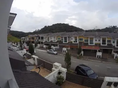 a view of a street in a town with houses at alyaleesya homestay Teres in Brinchang