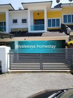 a house with a gate in front of it at alyaleesya homestay Teres in Brinchang