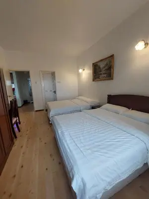 a room with three beds in a room at Little England B8 in Bukit Fraser
