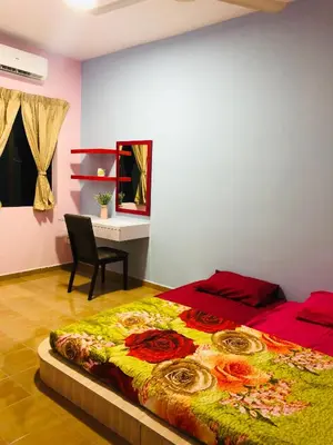 a bedroom with a bed and a chair and a desk at Seri Manjung HomeStay @Spacious Family Home in Seri Manjung