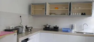a kitchen with white cabinets and a counter top at Silverpark Resort C2-5-1 or C3-3A-2 walk up in Bukit Fraser