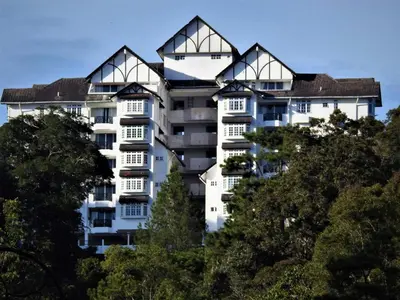 a large white apartment building with many windows at Silverpark Resort C2-5-1 or C3-3A-2 walk up in Bukit Fraser