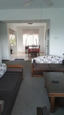 a living room with two beds and a couch at Silverpark Resort C2-5-1 or C3-3A-2 walk up in Bukit Fraser