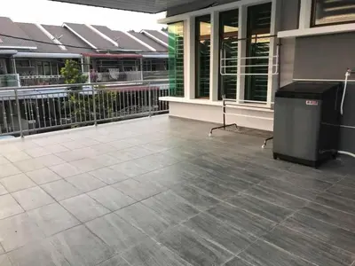 a building with a trashcan in the middle of a patio at Family Homestay in Taiping