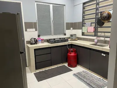 a kitchen with a red fire hydrant in the middle at Cameron Lavender Homestay in Cameron Highlands