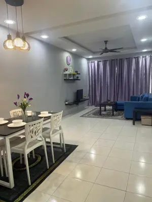 a living room with a table and chairs and a couch at Cameron Lavender Homestay in Cameron Highlands