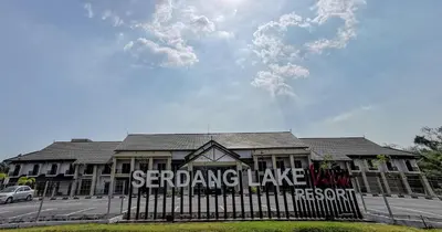 a building with a fence in front of it at SERDANG LAKE VIEW RESORT in Sungai Kechil