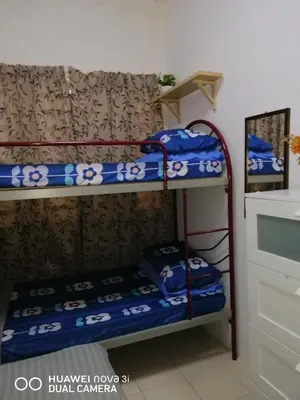 a couple of bunk beds in a room at Alyaleesya Muslim Homestay in Tanah Rata