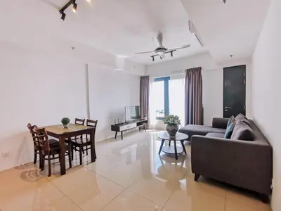 a living room with a couch and a table at Tropicana 218 Macalister by Simply Penang in George Town