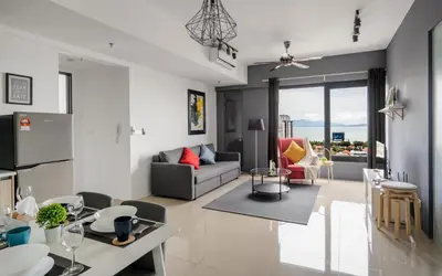 a living room with a couch and a table at Tropicana 218 Macalister by Simply Penang in George Town