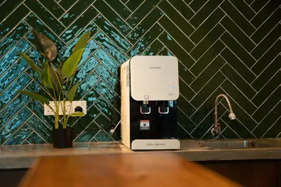 a power outlet on a counter next to a sink at Carnarvon Suites in George Town