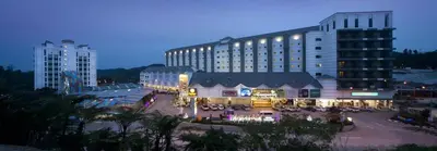 a large building with a courtyard in front of it at Cameron Nova Highlands Resort I in Cameron Highlands