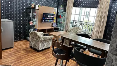 a restaurant with a table and chairs in a room at EagleNest at Iris House Resort in Tanah Rata