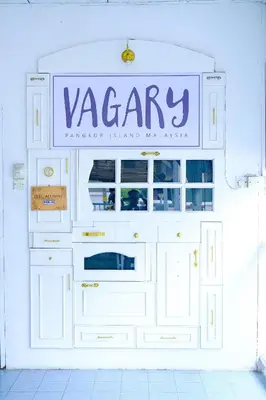 a large white dresser with a sign on it at Vagary Pangkor in Pangkor