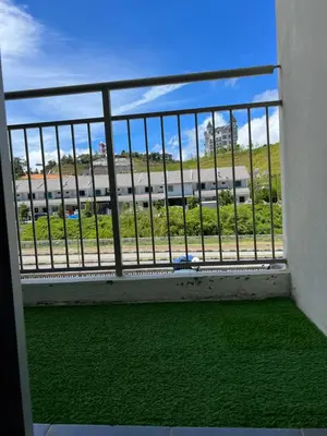 a balcony with a view of a train at Cahaya Gardens 2 rooms at Golden Hills depan pasar malam in Brinchang