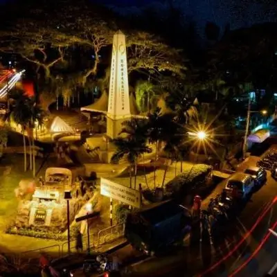 a view of a clock tower at night at Fastbook Bendera Home 8 & 10pax in Ayer Itam