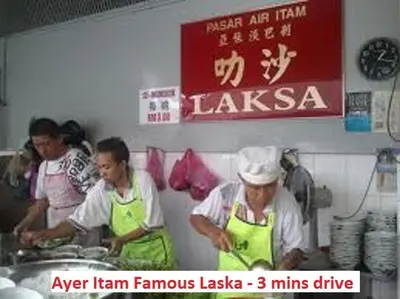 a group of people in a kitchen preparing food at Fastbook Bendera Home 8 & 10pax in Ayer Itam