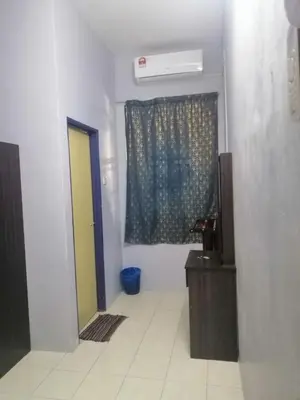 a room with a door and a window with a heater at Syaqisya Homestay in Seri Manjung