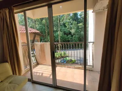 an open sliding glass door to a balcony with a view at Jana View Condotel MN in Kamunting
