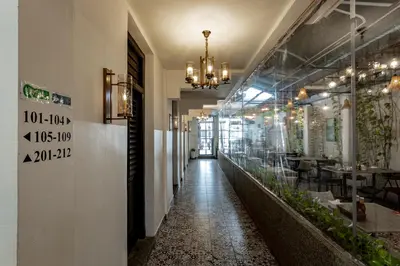 a corridor of a restaurant with a long hallway at Earnest Hotel Georgetown in George Town