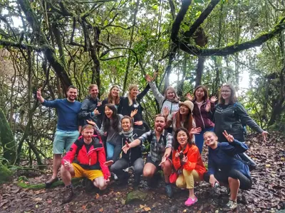 a group of people posing for a picture in the woods at A3A Oastel CoLiving in Tanah Rata
