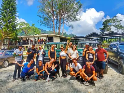 a group of people are posing for a picture at A3A Oastel CoLiving in Tanah Rata