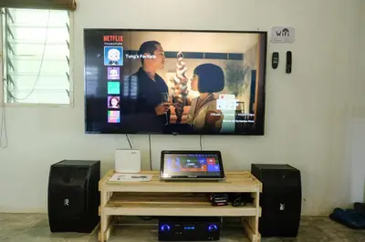 a flat screen tv hanging on a wall at Tung's Factoria Cameron Highland in Cameron Highlands