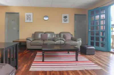 a living room with a couch and a coffee table at Hotel Check Inn 2 Cameron Highlands in Brinchang