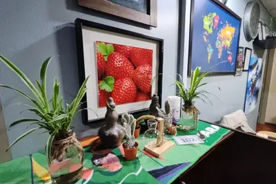 a table with a picture of strawberries on it at Hotel Check Inn 2 Cameron Highlands in Brinchang